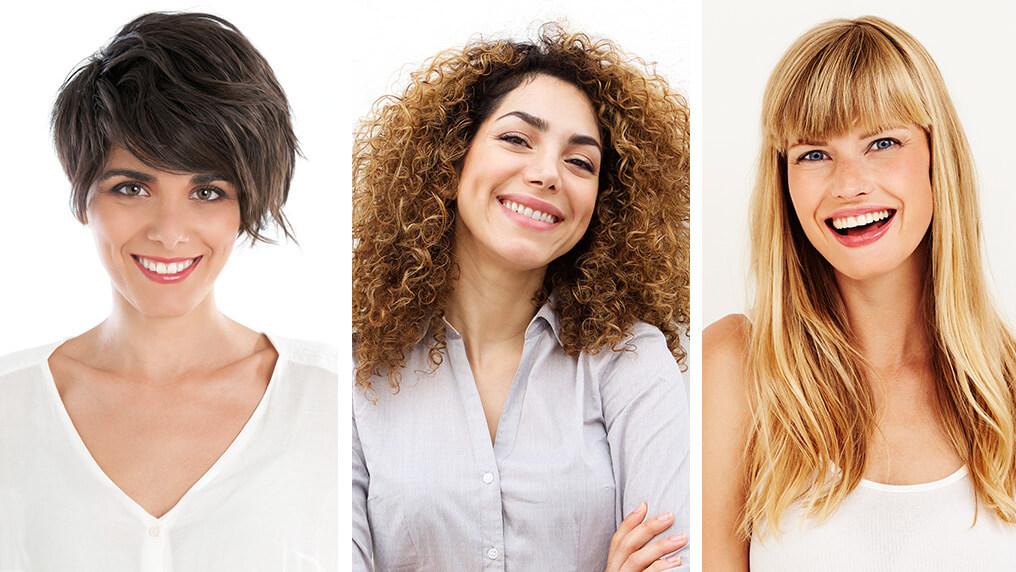 Três mulheres com estilos de cabelos diferentes: curto e liso, cacheado e grande e liso com franjinha